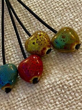 Unique necklace with 4 ceramic differently patterned hearts. SALE
